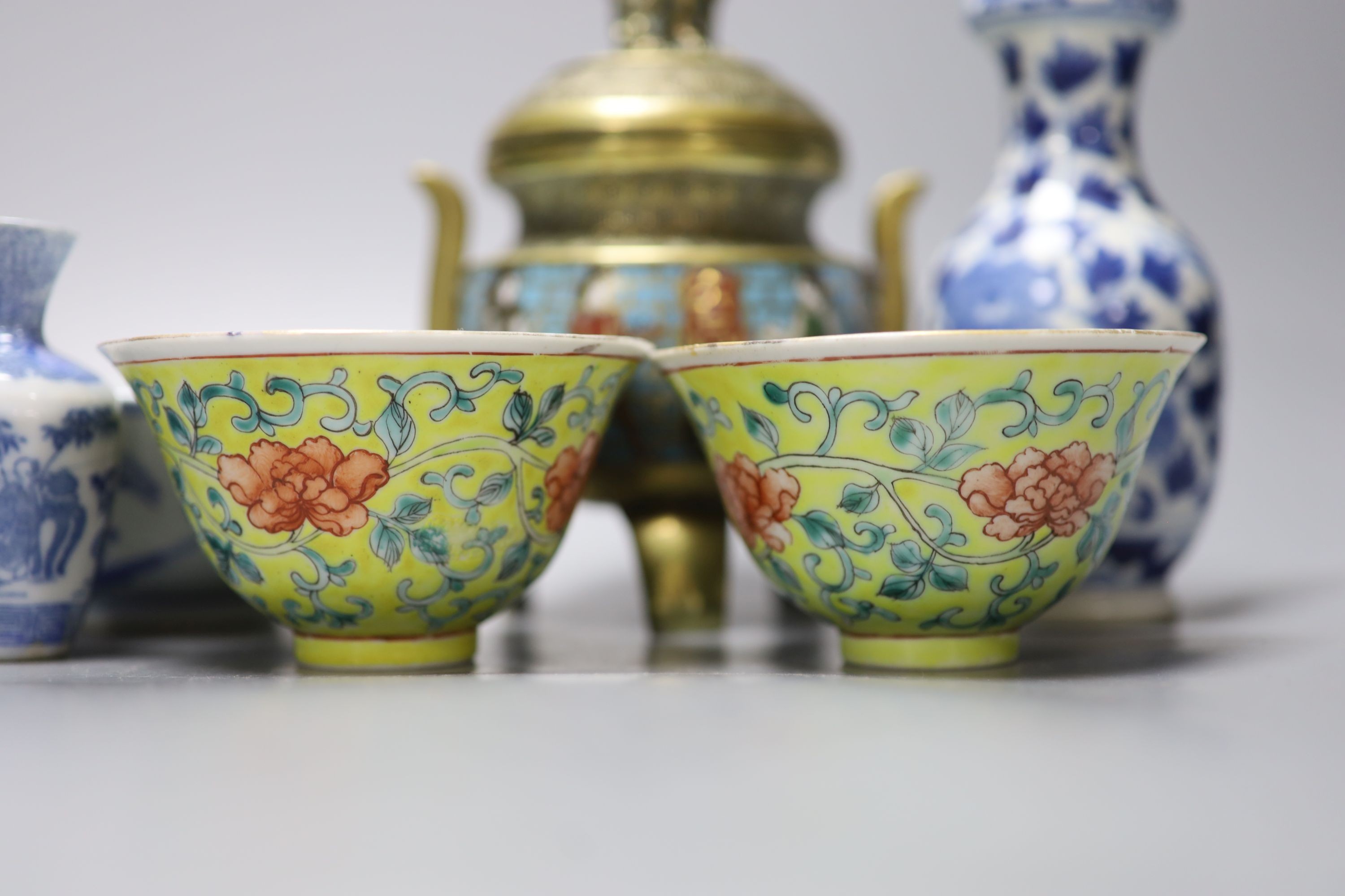 A group of Chinese porcelain, 19th /20th century, to include a pair of yellow ground bowls, 10.8 cm diameter, a blue and white vase, Xuande mark, a similar bowl and vase, and a champleve enamel bronze koro and cover
